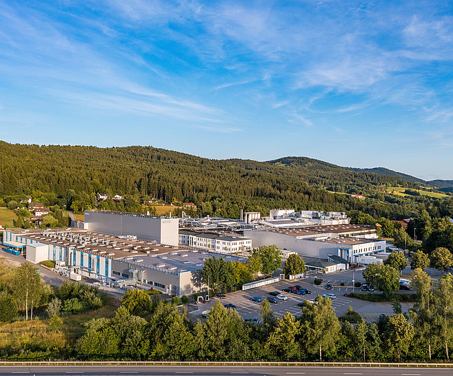 The picture shows Bischof+Klein Konzell in Bavaria from above. The various production halls and office buildings can be seen