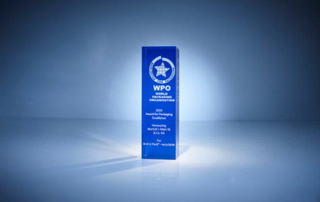 The World Packaging Award against a dark blue background. The award is in the center of the frame and is illuminated