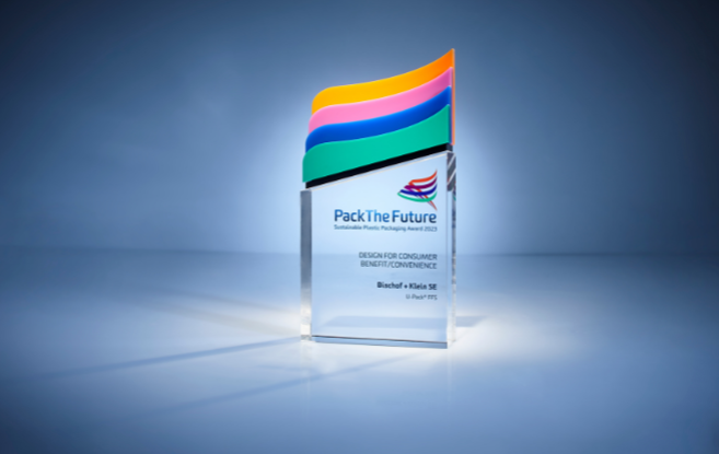 The Pack the Future Award against a dark blue background. The award is in the center of the frame and is illuminated