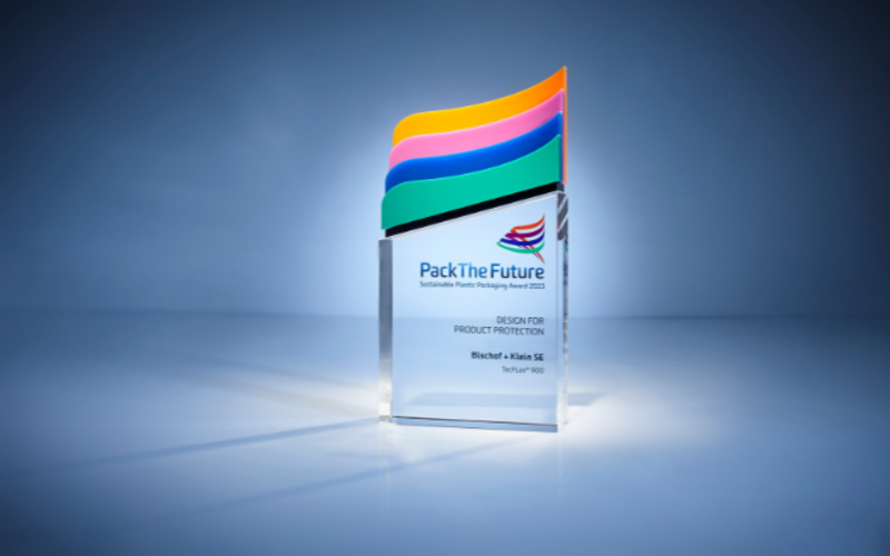 The Pack the Future Award against a dark blue background. The award is in the center of the frame and is illuminated